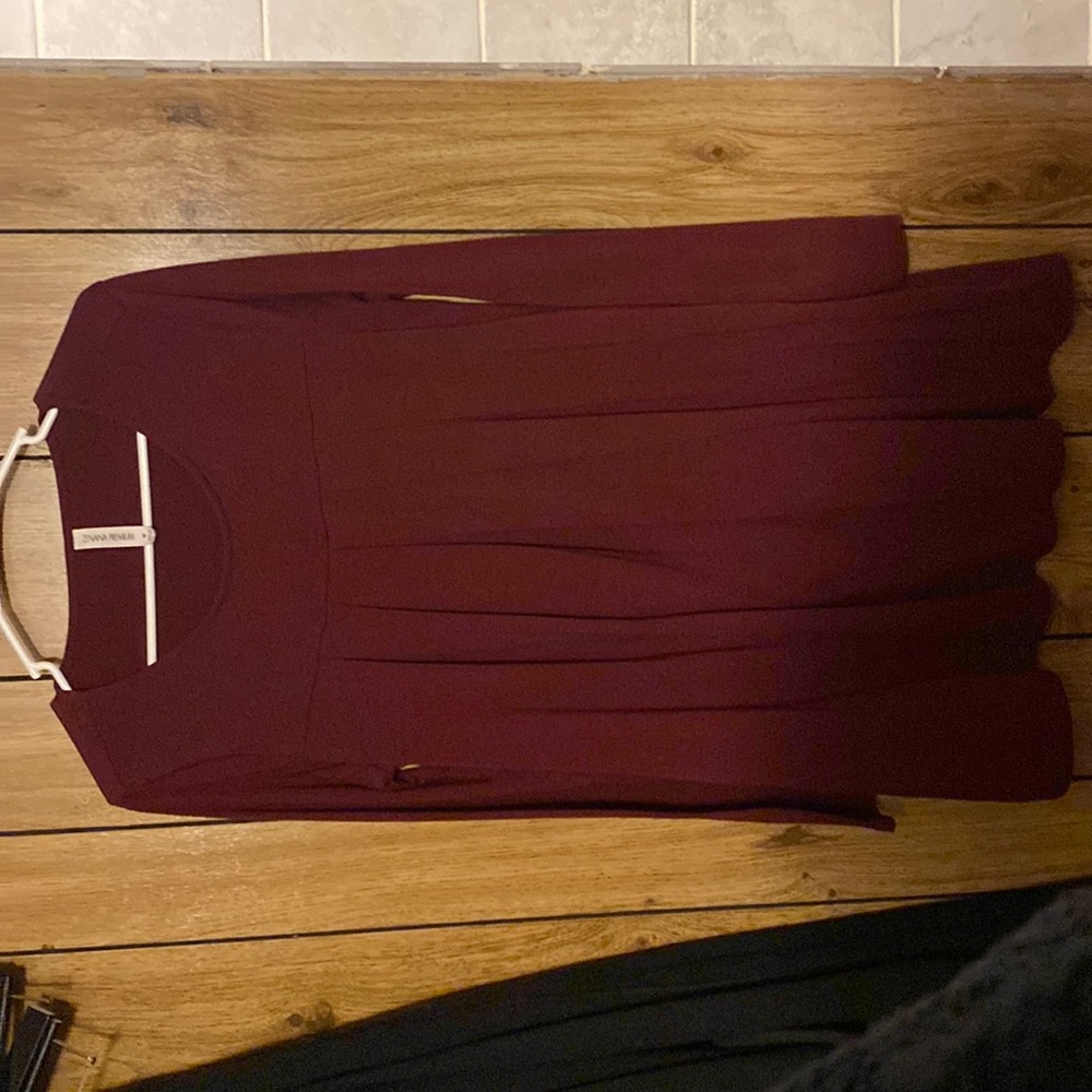 Woman’s maroon long sleeve dress with pockets. Size M.